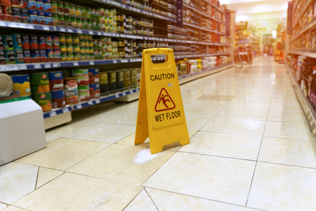 Yellow sign - caution. Wet floor is in the supermarket